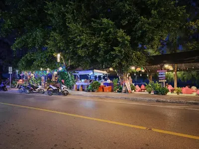 a group of motorcycles parked on the side of a street at Rawai Beachfront - Studio room on 2 floor in Rawai Beach