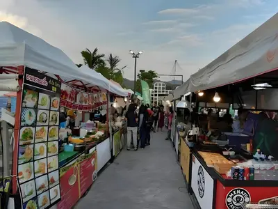 a group of food stalls with people walking between them at xx GO INN Ao Nang Krabi - โกอินน์ อ่าวนาง กระบี่ Aonang in Ban Khlong Haeng