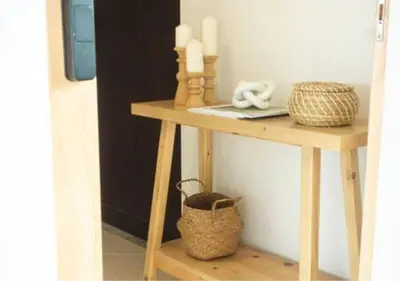 a table with a laptop and a basket on it at Mango Moon Phuket Tropical 2BR near Central Phuket in Ban Rangeng
