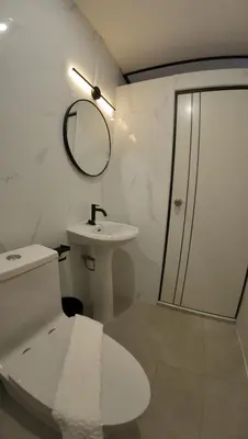 a bathroom with a toilet and a sink and a shower at Jong's House- Phi Phi Island in Phi Phi Don