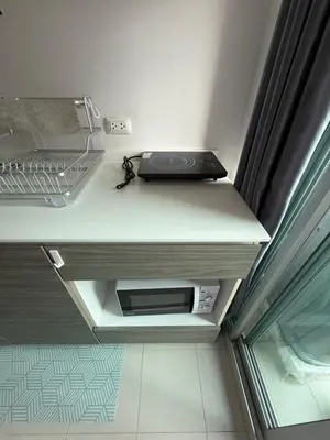 a laptop sitting on a shelf in a room at Dcondo mine Kathu Phuket in Kathu