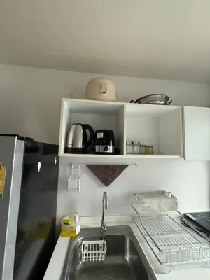 a kitchen with a sink and a counter top at Dcondo mine Kathu Phuket in Kathu