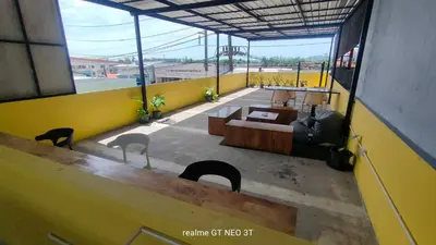 a view of a room with a yellow wall at Amahostel in Ban Thalat Choeng Thale