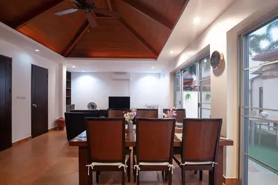 a dining room with a table and chairs at Balinese 3BR Pool Villa Freya, Spacious Courtyard, 70 m from Stay Wellbeing & Lifestyle in Rawai Beach
