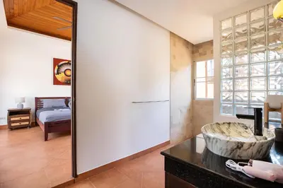 a large mirror in a room with a bedroom at Balinese 3BR Pool Villa Freya, Spacious Courtyard, 70 m from Stay Wellbeing & Lifestyle in Rawai Beach