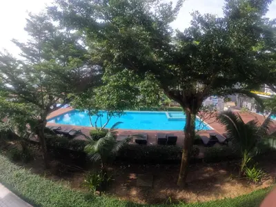 a swimming pool with trees in front of it at At Seacondo-1 Bedroom-A07 in Haad Klong Son