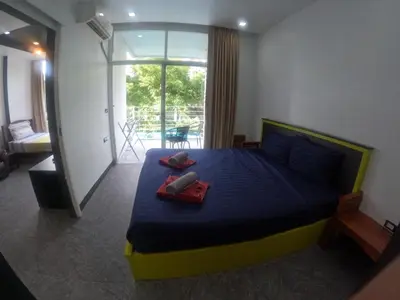 a bedroom with a bed with two pillows on it at At Seacondo-1 Bedroom-A07 in Haad Klong Son