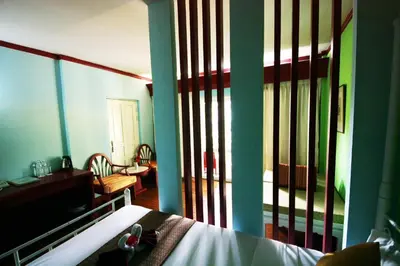 a bedroom with a bed and a room with a balcony at Successive BeachFront ,Krabi in Ban Khlong Haeng