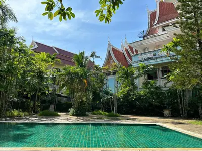 a swimming pool in front of a house at Successive BeachFront ,Krabi in Ban Khlong Haeng