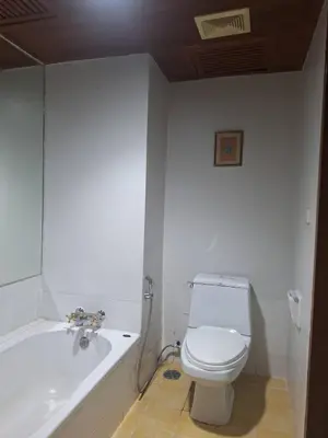 a bathroom with a toilet and a bath tub at Successive BeachFront ,Krabi in Ban Khlong Haeng