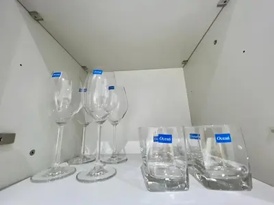 a row of wine glasses sitting on a table at 2 BR Modern Pool Villa Chalong in Ban Suan