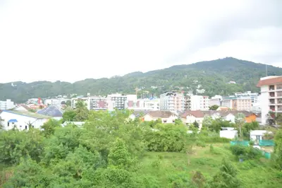 a view of a city with buildings and trees at Chilli Salza Patong in Patong Beach