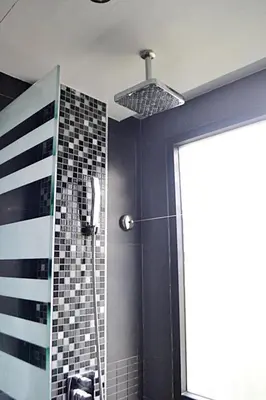 a bathroom with a shower with a shower head at Absolute Bangla Suites 69sqm with Jacuzzi in Patong Beach