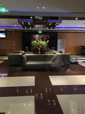 a lobby with a couch and chairs in a building at Absolute bangla suites 65 sqm with Jacuzzi in Patong Beach