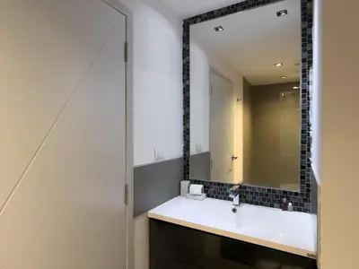 a bathroom with a sink and a mirror at Garden View Apartment 1BR - NV-103 in Chalong