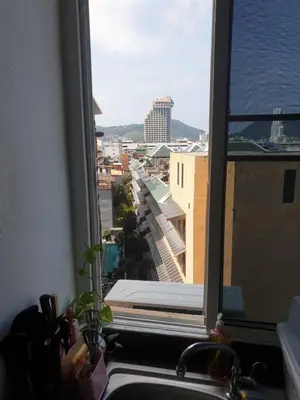 a window with a view of a city at Monkey Apartment in Patong Beach