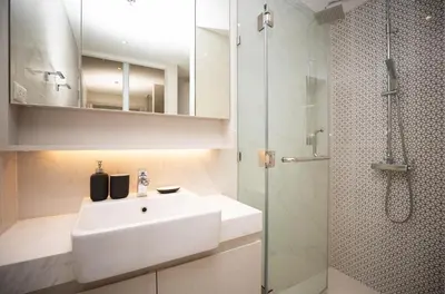 a bathroom with a white sink and a shower at Cassia 1BR City View apt by NLA in Bang Tao Beach
