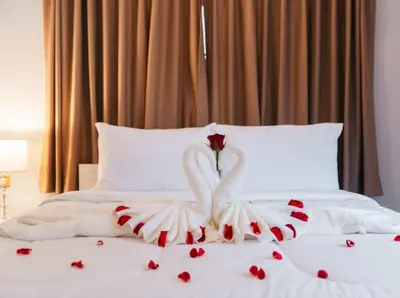 a swan made out of hearts on a bed at Pool Villa Tambon Patong in Patong Beach