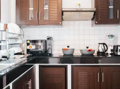a kitchen with a counter top with bowls on it at Pool Villa Tambon Patong in Patong Beach