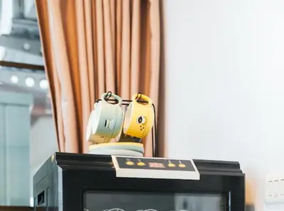 a television with two controllers sitting on top of it at Pool Villa Tambon Patong in Patong Beach