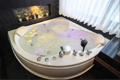 a bath tub in a room with at Studio Apartment in Bangla Rd in Patong Beach