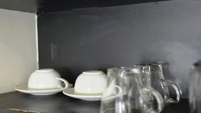 a group of cups and plates on a table at Bright & Breezy -1BR T1-211 in Chalong