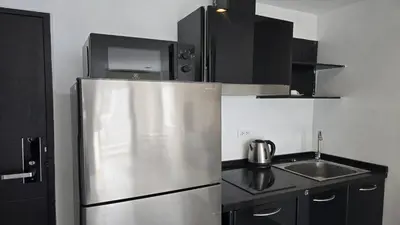 a kitchen with a stainless steel refrigerator and a sink at Big Buddha View Apt-1BR T1-306 in Chalong