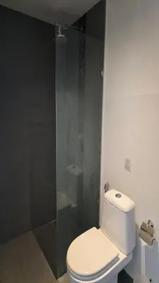 a bathroom with a toilet and a glass shower at Big Buddha View Apt-1BR T1-306 in Chalong