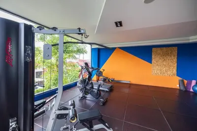 a room with a gym with a bike in it at Modern & Cozy Apartment 1BR - NV-413 in Chalong