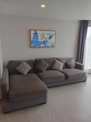 a brown couch sitting in a living room at Modern & Cozy Apartment 1BR - NV-413 in Chalong