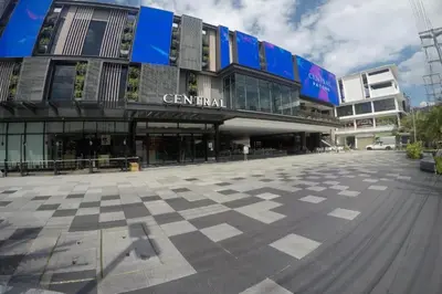 a large building with a checkered floor in front of it at Patong Station House in Patong Beach