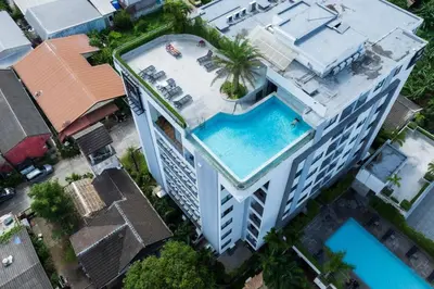 an overhead view of a building with a swimming pool at Modern & Stylish Apartment-2BR - NV-518 in Phuket Town