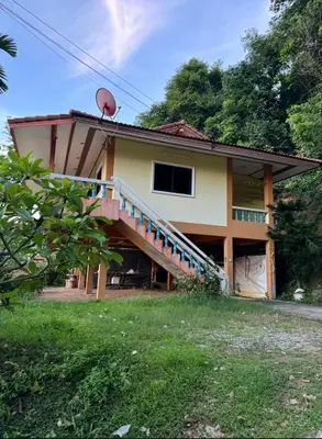 a house with a staircase on the side of it at Sea Dreamer Ao Yon Beach House in Ban Ao Makham