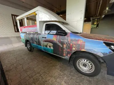 a food truck parked in a building with its door open at Emerald Terrace Condo 9-1 Bed City & Mountain in Patong Beach
