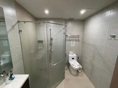 a bathroom with a shower and a toilet at Emerald Terrace Condo 9-1 Bed City & Mountain in Patong Beach