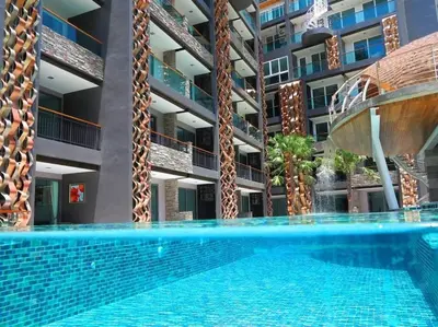 an empty swimming pool in front of a building at Emerald Terrace Condo 9-1 Bed City & Mountain in Patong Beach