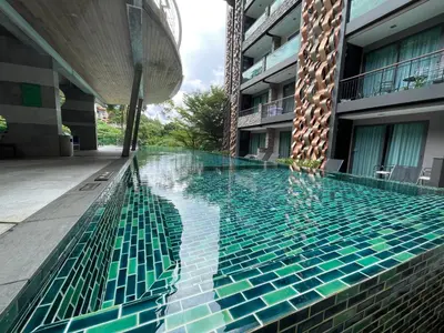 a swimming pool in the middle of a building at Emerald Terrace Condo 9-1 Bed City & Mountain in Patong Beach