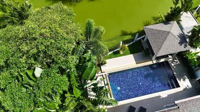 an overhead view of a swimming pool and trees at Lake view 3 bedrooms Pool Villa in Rawai Beach
