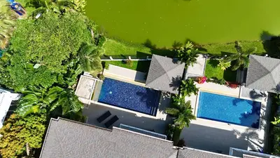 an overhead view of a house with two swimming pools at Lake view 3 bedrooms Pool Villa in Rawai Beach