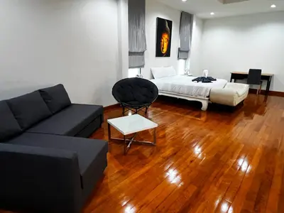 a living room with a bed and a couch at Lake view 3 bedrooms Pool Villa in Rawai Beach