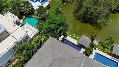 an overhead view of a house and a pool with water at Lake view 3 bedrooms Pool Villa in Rawai Beach