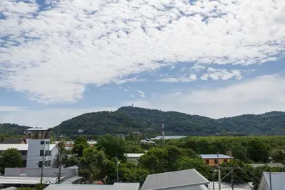 a view of a city with a mountain in the background at Well located Apt 1BR - T2-421 in Chalong