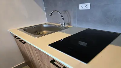 a kitchen counter with a sink and an electrical outlet at The Chalong Pearl 1BR T1-703 in Phuket Town