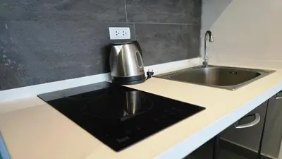 a kitchen with a sink and a coffee pot on a counter at Urban loft 1BR T1-706 in Chalong