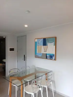 a dining room with a glass table and chairs at 2BR Aparment Near The Beach T2-717 in Phuket Town