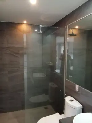 a bathroom with a toilet and two sinks and a mirror at 2BR Aparment Near The Beach T2-717 in Phuket Town