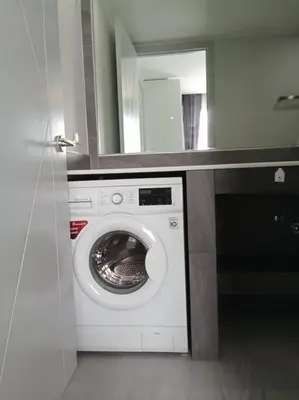 a washing machine in a bathroom with a mirror at 2BR Aparment Near The Beach T2-717 in Phuket Town