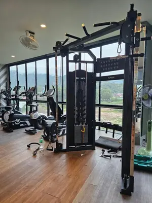 a gym with a bunch of treadmills and machines at 1BDR Rooftop bar The biggest gym Spa centre in Kamala Beach