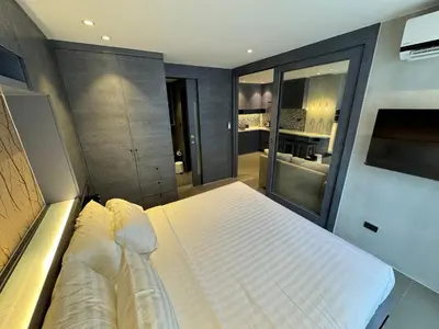 a bedroom with a large bed in a room at 1BDR Rooftop bar The biggest gym Spa centre in Kamala Beach