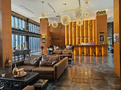 a lobby with couches and a bar in a building at 1BDR Roof pool 500m to beach Great gym Parking in Kamala Beach